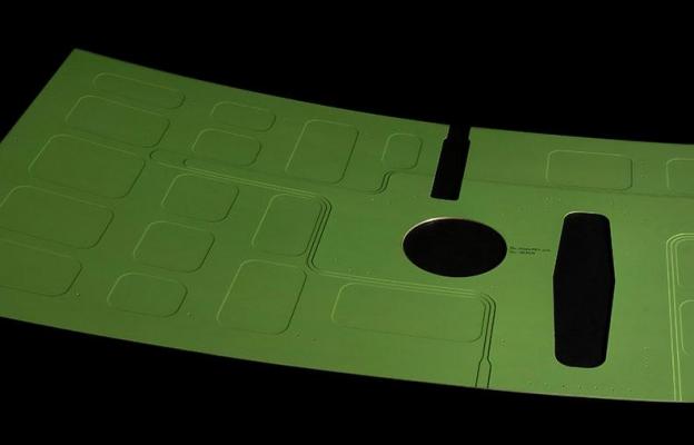 Product shot of green part on black background