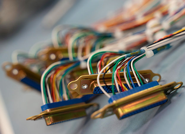 Close up on wire harnesses with multi-colored wires